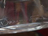 a close up of a wine glass with a label on it