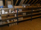 a room with a lot of boxes and boxes on the shelves