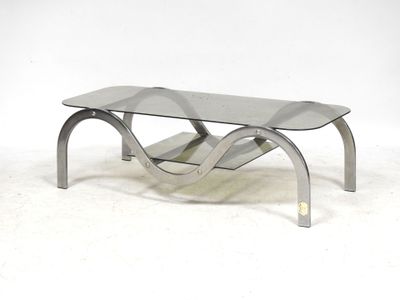an image of a glass coffee table with metal legs
