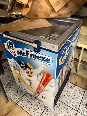 a box of ice cream sitting on the floor
