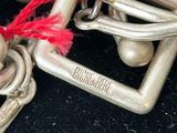 a close up of a metal object with a red string