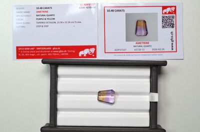 a picture of a purple diamond in a display case