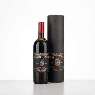 a bottle of red wine next to a black box