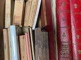 a box full of books sitting on a table