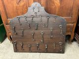 a wooden display with a bunch of keys on it