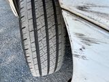 a close up of a car tire on the side of the road