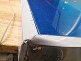 a laptop computer sitting on top of a wooden desk