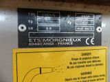 a sign on the side of a machine that says it ' s morgniux