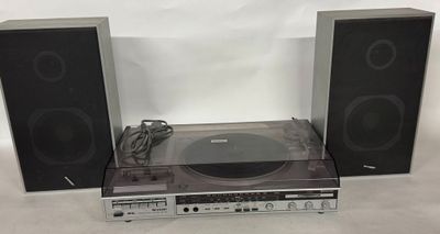 a close up of a stereo system with speakers and a record player