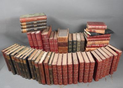 a lot of old books stacked on top of each other