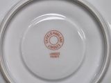 a white plate with a red and white design on it