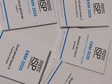 a lot of business cards sitting on a table
