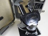 a microscope that is sitting on top of a piece of luggage