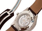 a close up of a wrist watch with a brown strap