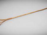 une cuillère en bois avec un manche, posée sur une surface grise