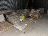 a lot of pallets and boxes of wood in a warehouse