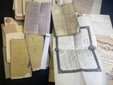 a pile of old papers sitting on top of a table