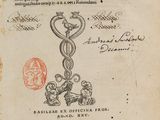 un vieux livre sur lequel figure le symbole médical