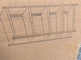 a cardboard box with a drawing on it sitting on the floor