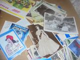 a table with a lot of old photos and postcards on it