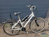 a bicycle that is parked next to a building