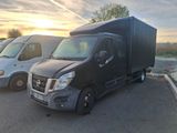 two vans parked in a parking lot next to each other