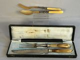 two knives and a fork in a case on a table