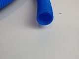a blue hose sitting on top of a table next to a wall