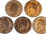 four different types of coins are shown on a white surface