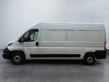 a white van that is parked in a parking lot