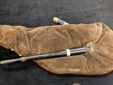 an old pair of baseball bats laying on the ground