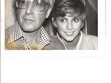 a black and white photo of a man and a young boy