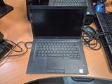 a laptop computer sitting on top of a desk next to a keyboard and mouse