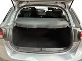the back of a car with the trunk open and the seats folded down