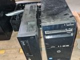 two computers sitting on a pallet in a warehouse