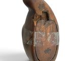 a brown vase with a handle on a white surface