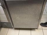 a silver dishwasher sitting in the middle of a kitchen