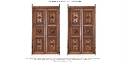 an image of a pair of wooden doors with carvings on them