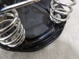 a close up of a pair of shoes and a pair of springs