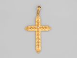 une croix dorée sur fond gris