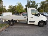 a white truck that is parked in a parking lot
