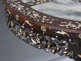 a table that has a marble top on it