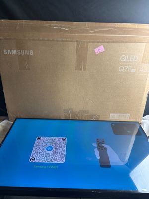 a laptop that is sitting on a table in front of a box
