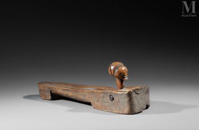 an old wooden hammer with a wooden handle on a gray background