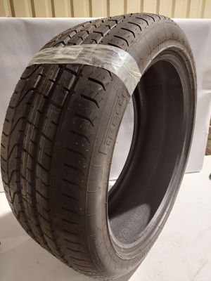 a close up of a tire on a white surface