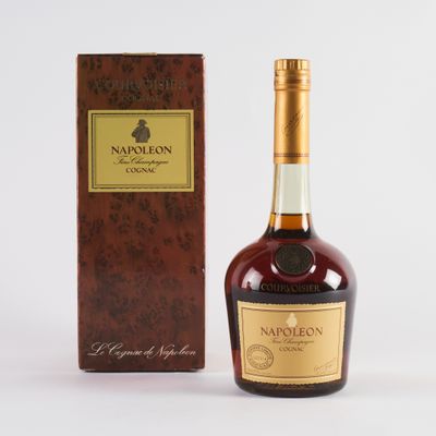 a close up of a bottle of liquor next to a box