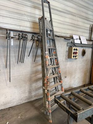 a ladder that is leaning against a wall in a garage
