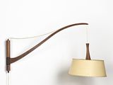 an image of a wall mounted lamp with a beige shade on it