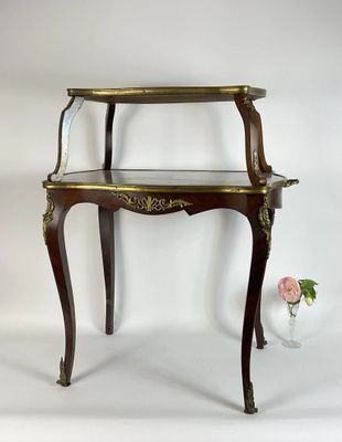 a small table with a glass shelf on top of it