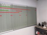 a white board with a bunch of red and green lines on it